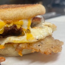 Rocket Sando. English muffin, fried egg, smashed tots, sausage and melted cheese.