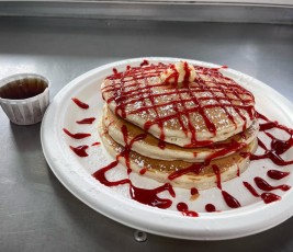 House made buttermilk pancakes with our very own strawberry sauce on top.