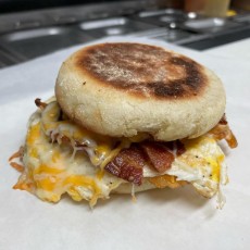 Bacon, egg, cheese and smashed tots in an English muffin.
